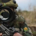 soldier holding a night vision scope
