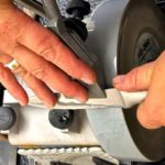 woman using a knife sharpener